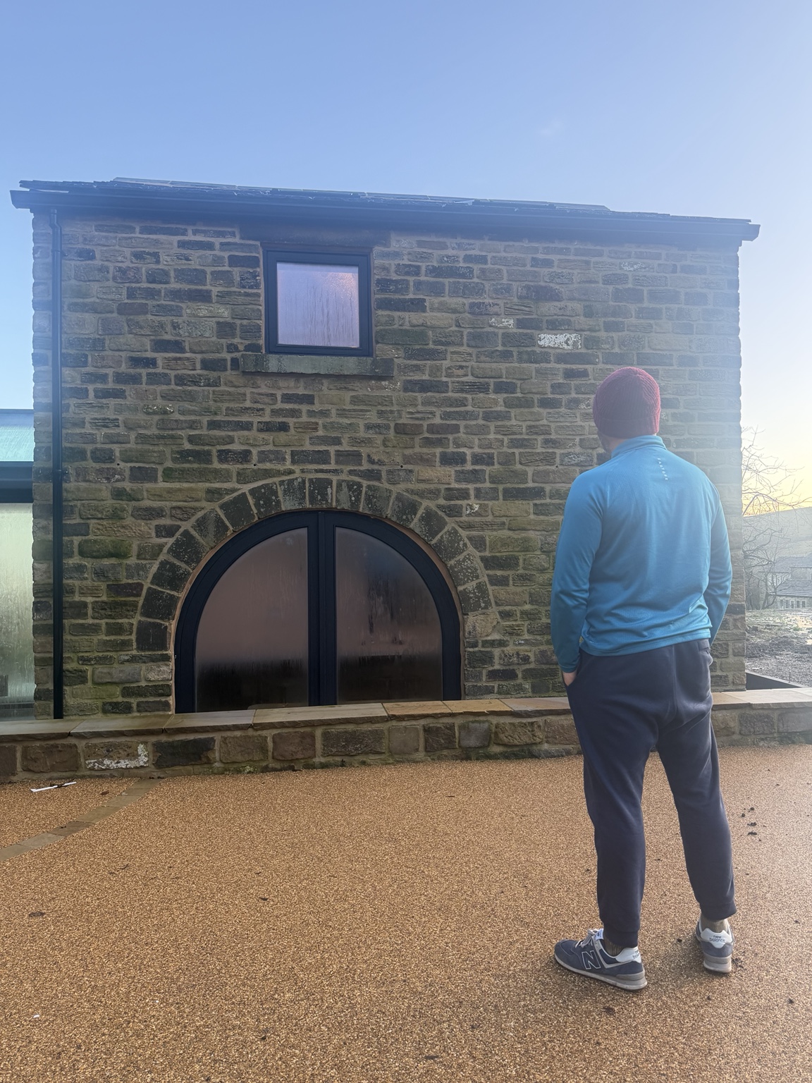 Stone building with arched opening
